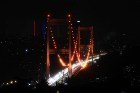 Istanbul's Fatih Sultan Mehmet Bridge Illuminated in Orange Lights